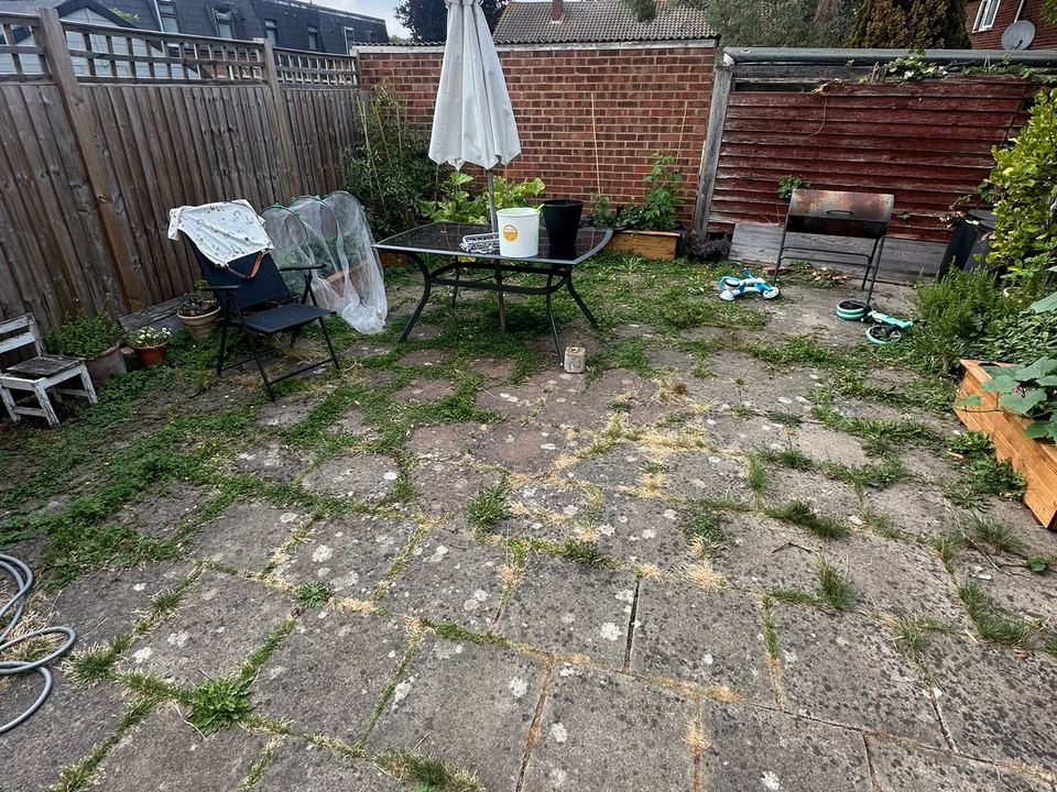 Paved garden patio before maintenance